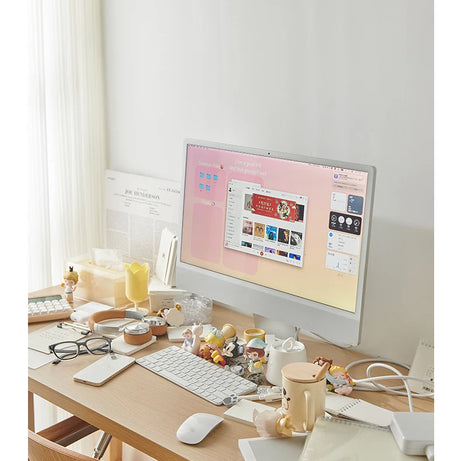 An image of a messy desk setup without monitor stand.