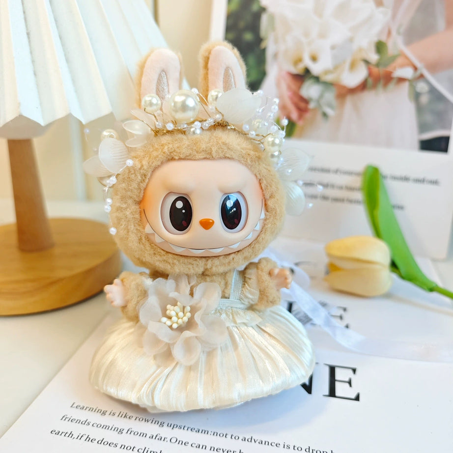 An image of yellow champagne with white pearl headband bud skirt for labubu by Fig Palace