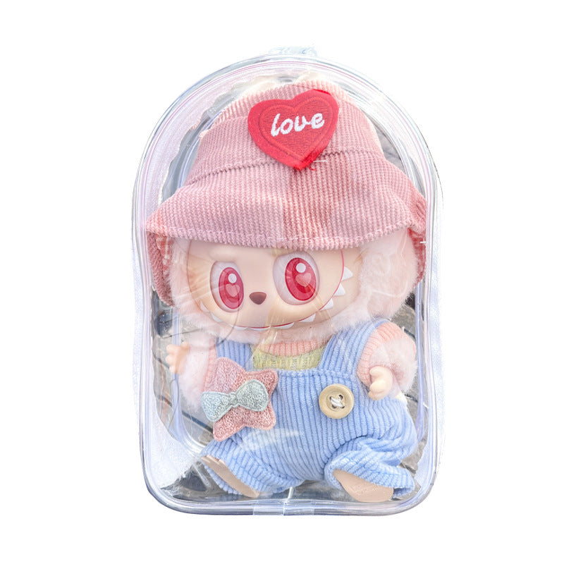 A close-up of a transparent PVC display bag featuring a Labubu figure in pastel overalls and a pink hat with a red heart patch. Perfect for showcasing and protecting small collectibles.