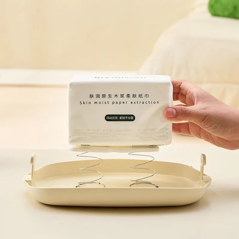 Open tissue box storage case showing refill process for soft pack tissues.
