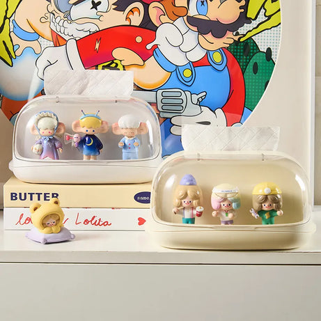 Stylish tissue box case displaying figures with colorful decor.