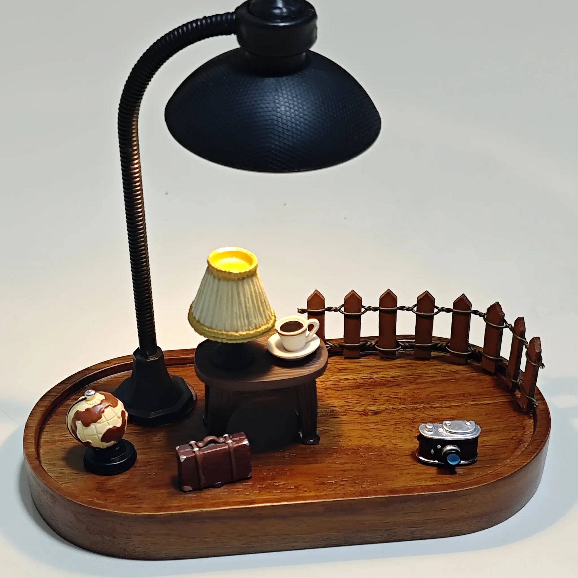 Wooden diorama base featuring miniature accessories such as globe, suitcase, lamp, fence, table, and camera, without Hirono figure.