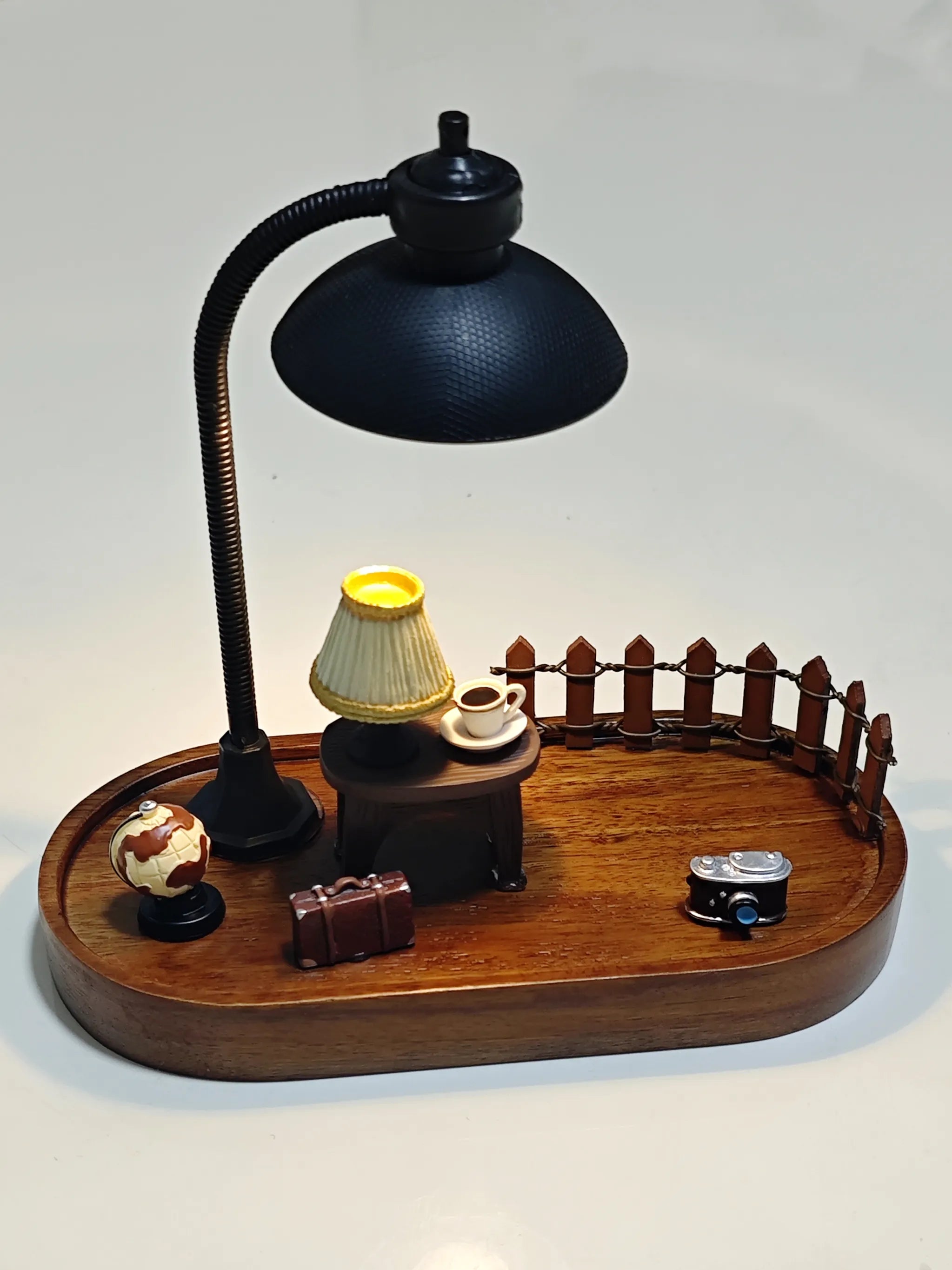 Wooden diorama base featuring miniature accessories such as globe, suitcase, lamp, fence, table, and camera, without Hirono figure.