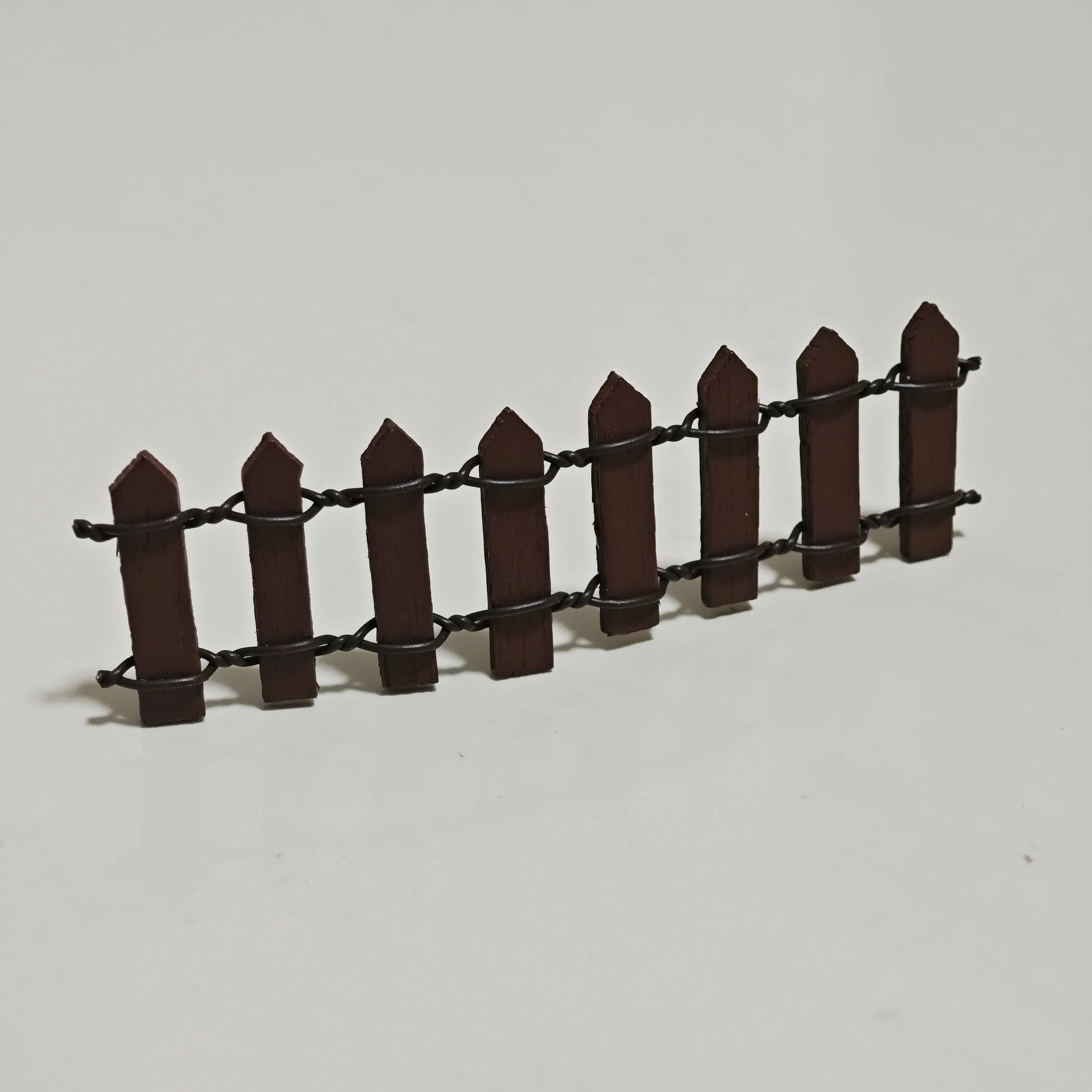 Close-up of miniature wooden fence accessory from Hirono diorama set.