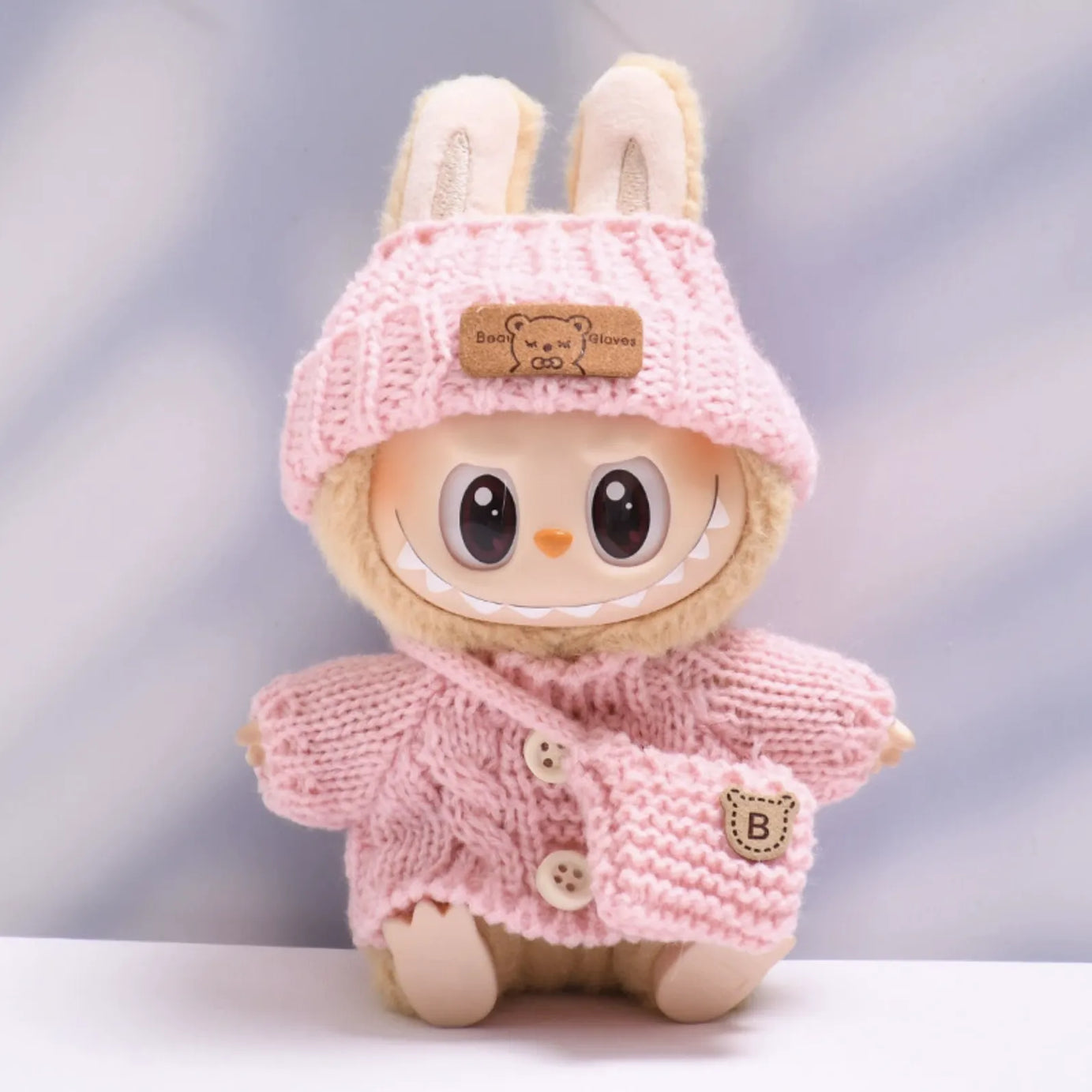 Light pink button sweater with light pink bear wool hat and light pink crossbody bag for Labubu v2 (POP MART THE MONSTERS Have a Seat Series Vinyl Plush Toys)
