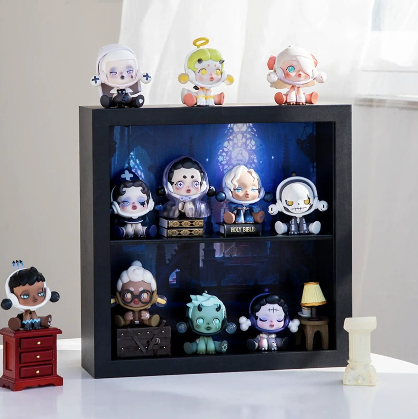 A squared black wooden display case from Fig Palace with two layers, featuring a collection of designed Skullpanda figures from Popmart, each with distinct colors and styles,neatly arranged for display.
