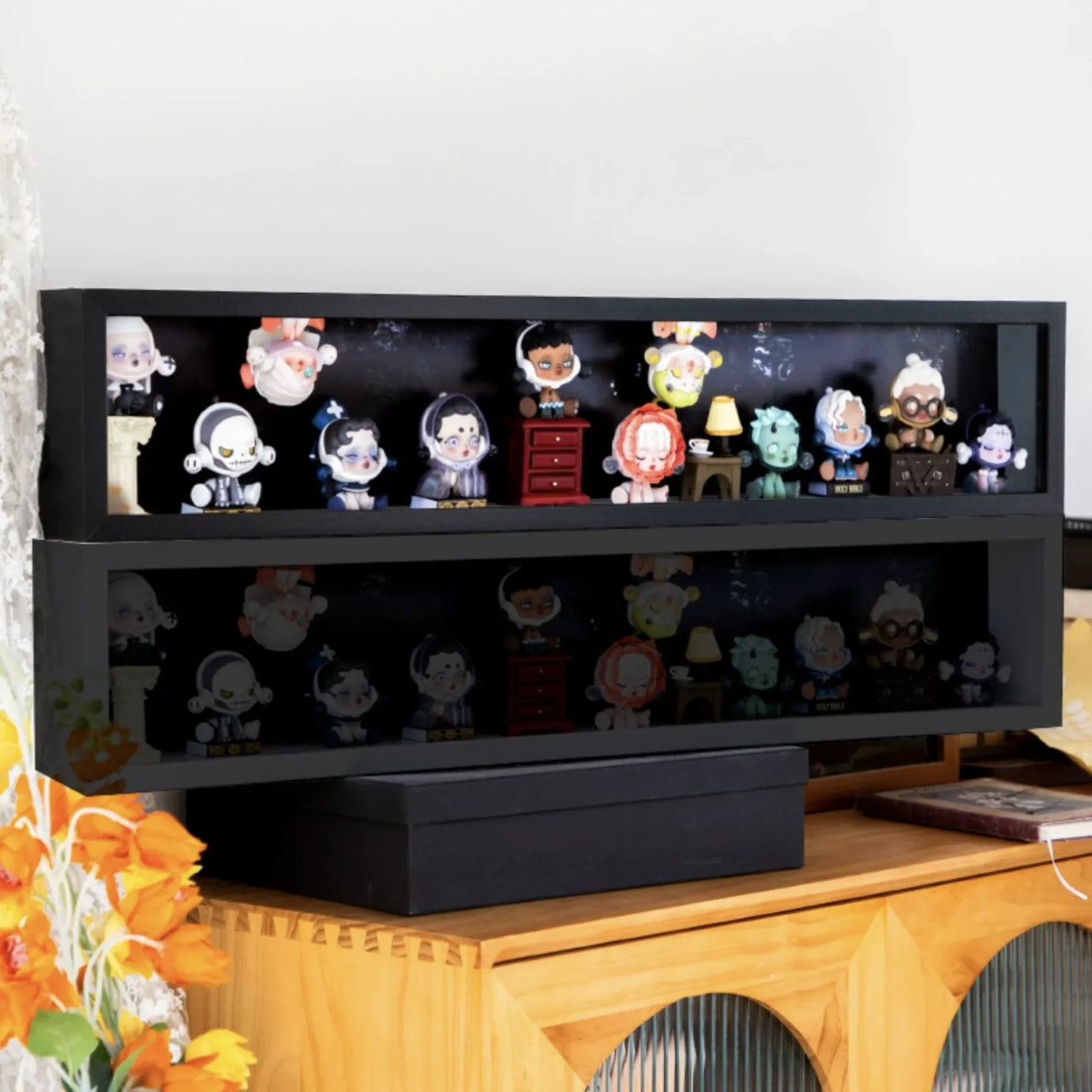 An image of FigPalace's black wooden black display case with 80cm wide and skullpanda, popmart figures inside. 