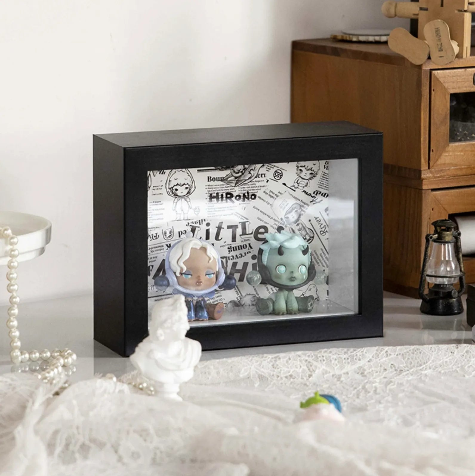 A squared black wooden display case from Fig Palace with one layer, featuring a collection of designed Skullpanda figures from Popmart, each with distinct colors and styles,neatly arranged for display.